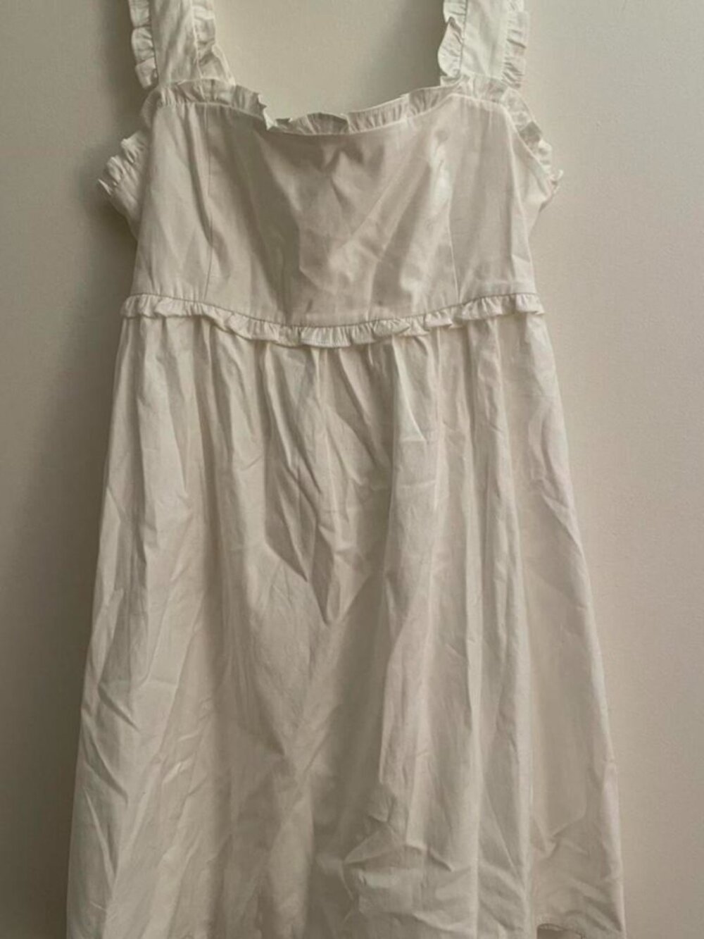 Reformation. Liah white mini dress with ruffles and tie back detail.
